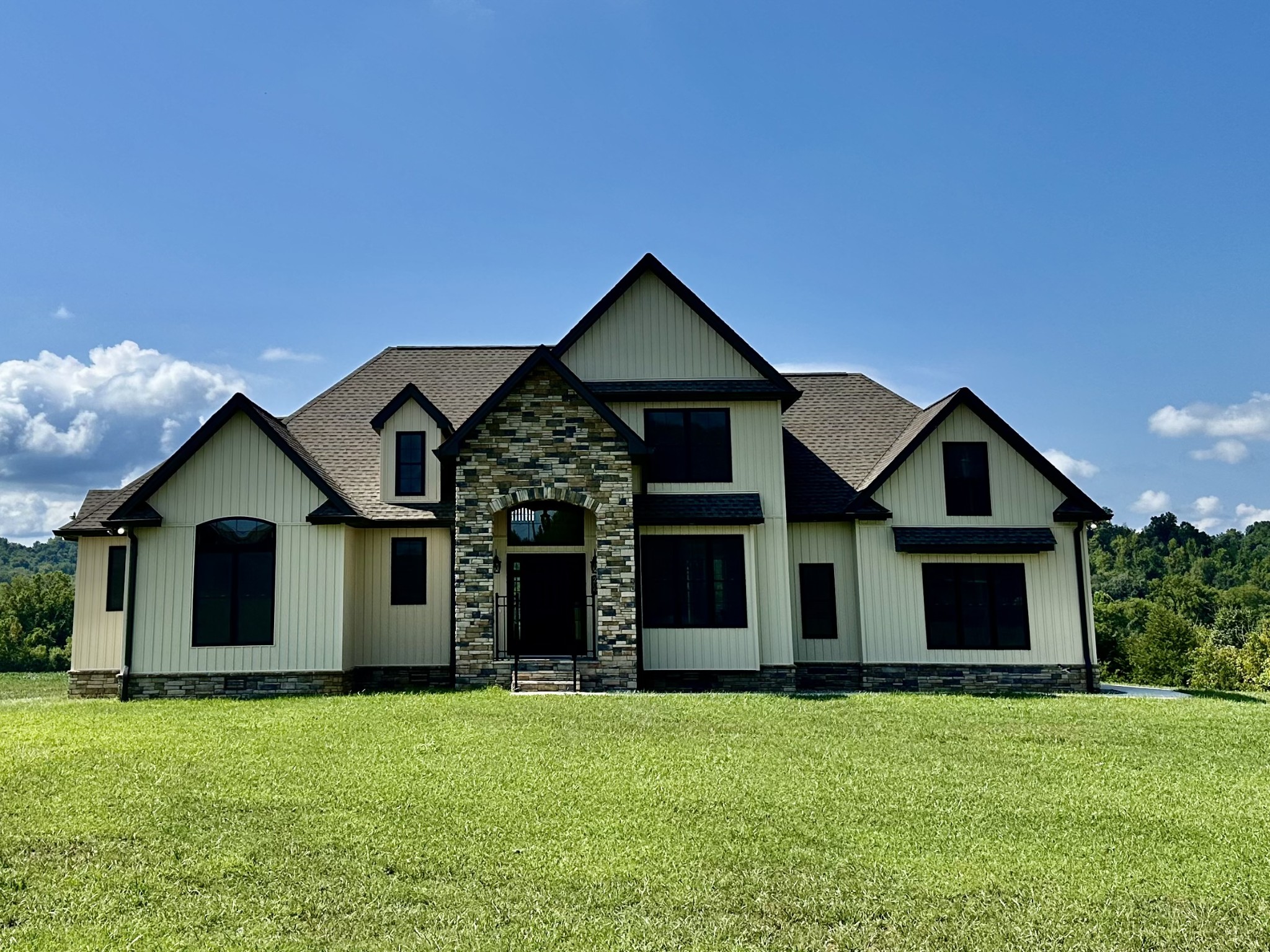 a front view of house with yard and green space