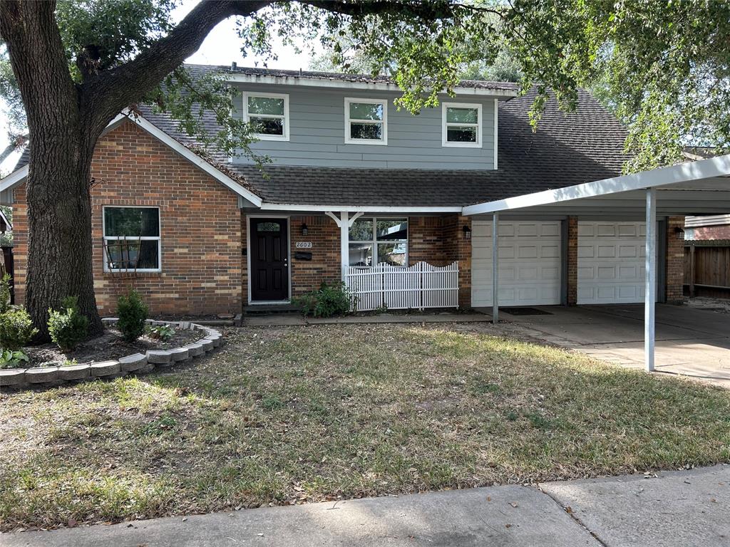 a front view of a house with garage