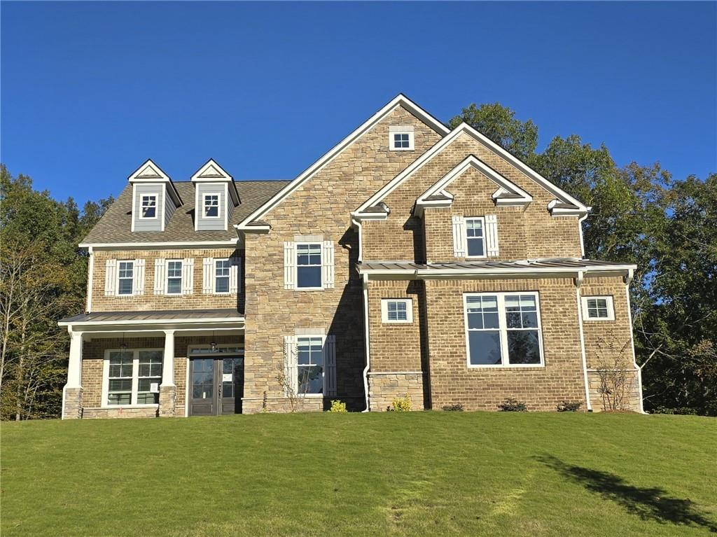 a front view of a house with a yard