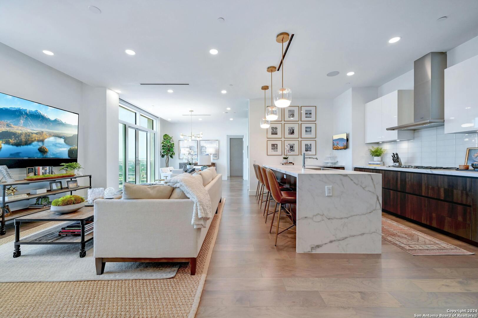 a living room with furniture and a flat screen tv