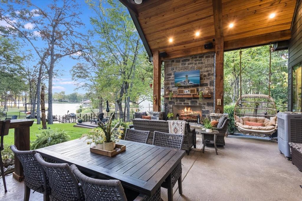 a view of a patio with a dining table and chairs