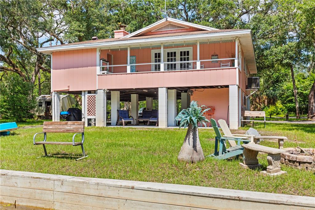 a front view of a house with swimming garden and porch