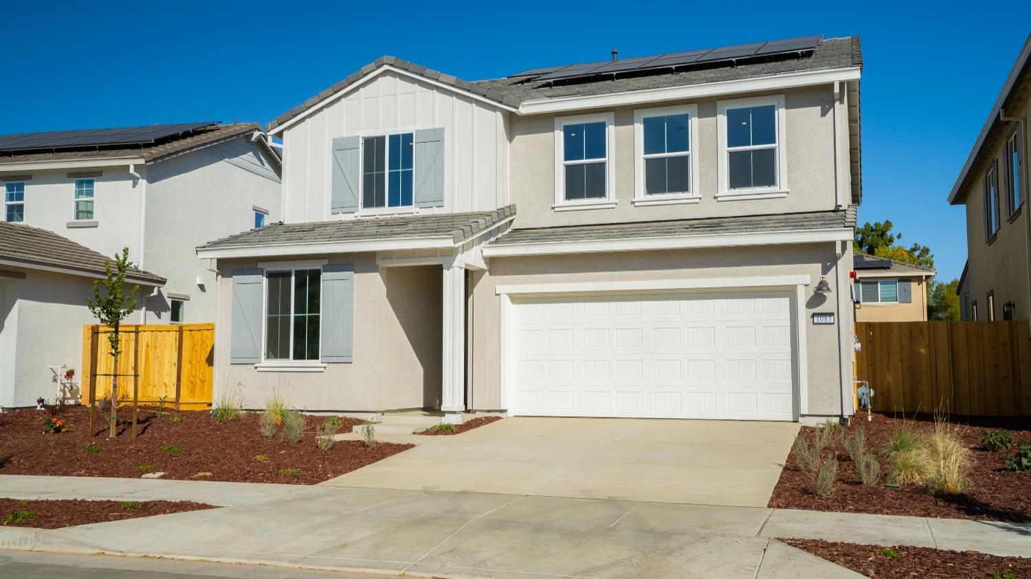 a front view of a house with a garage