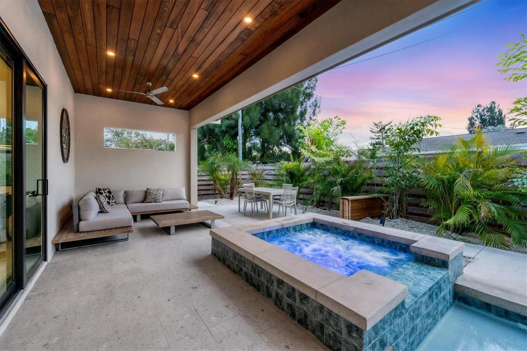 a outdoor space with patio couch and a potted plant