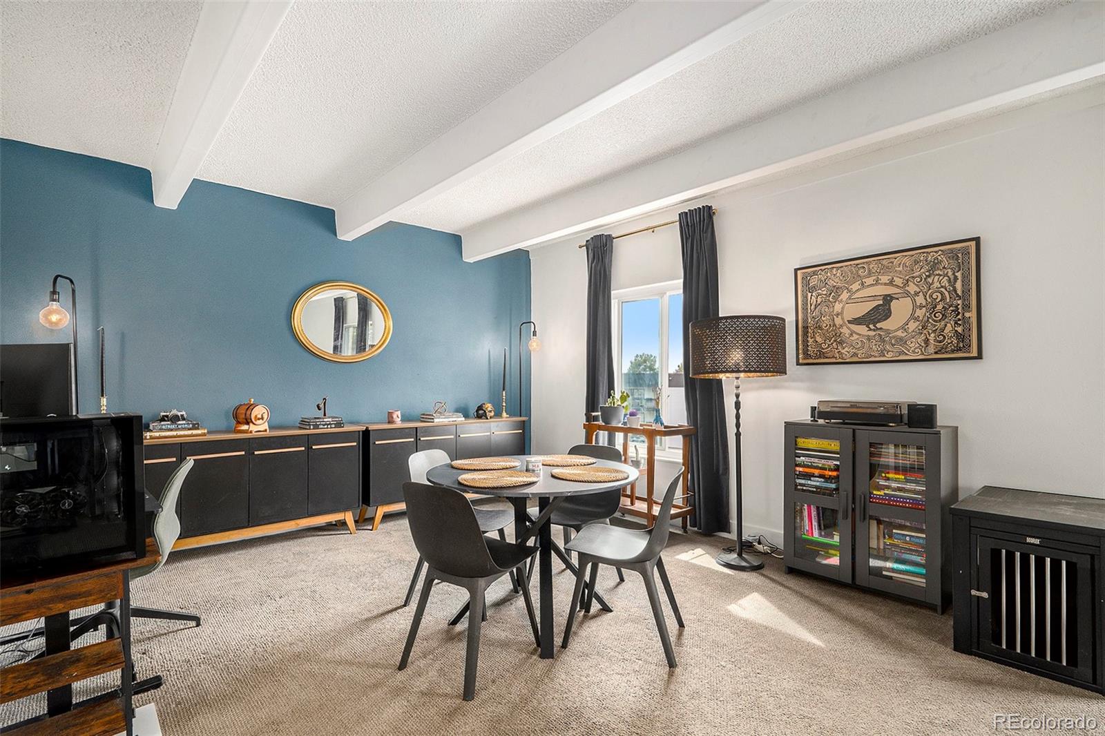 a kitchen with a table and chairs in it