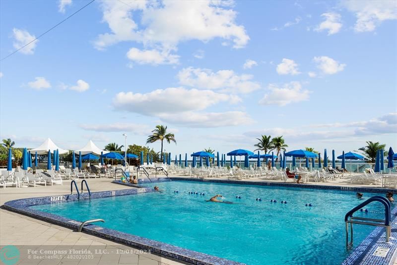 a view of swimming pool with outdoor seating