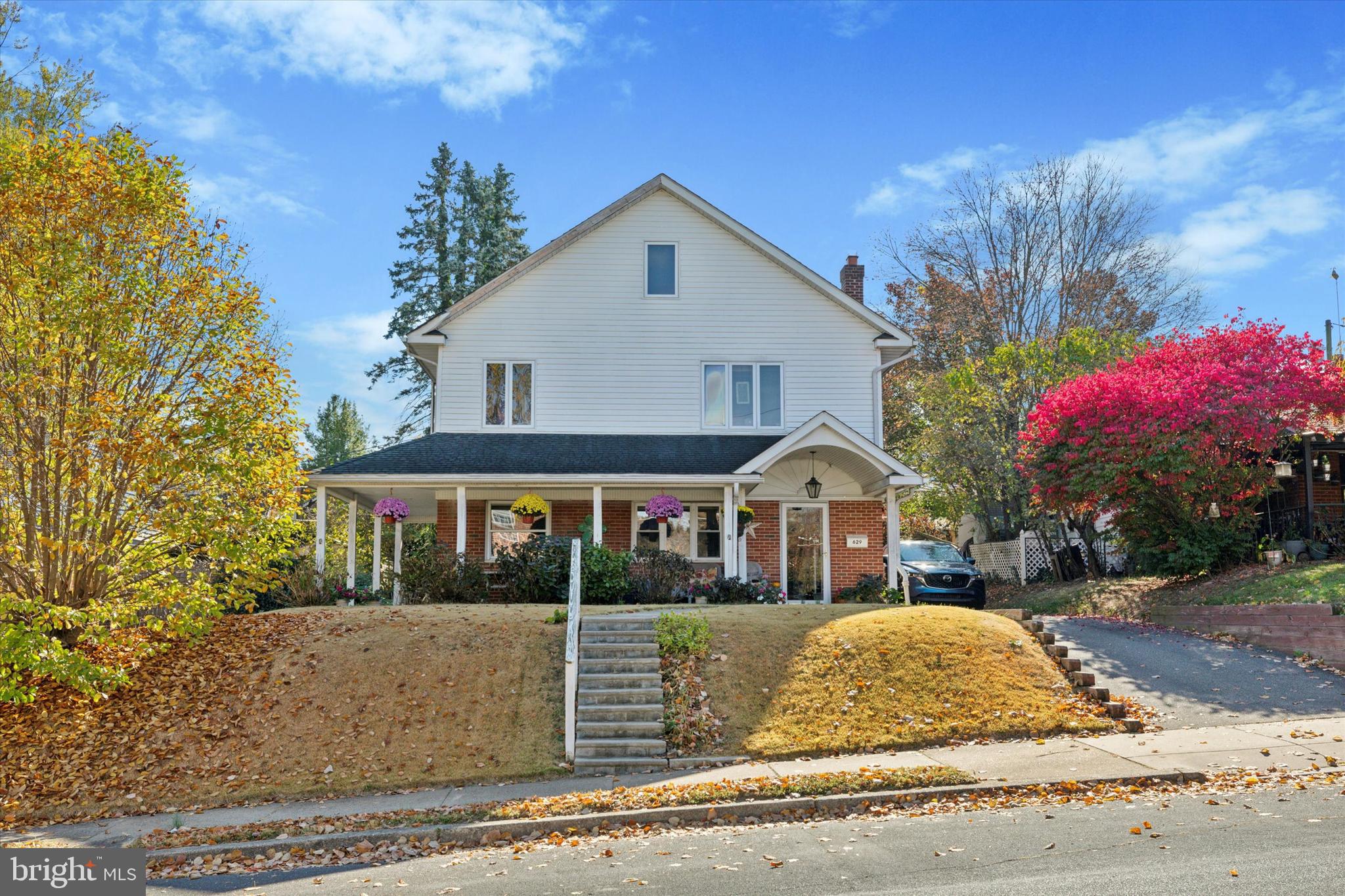 a front view of a house with a yard