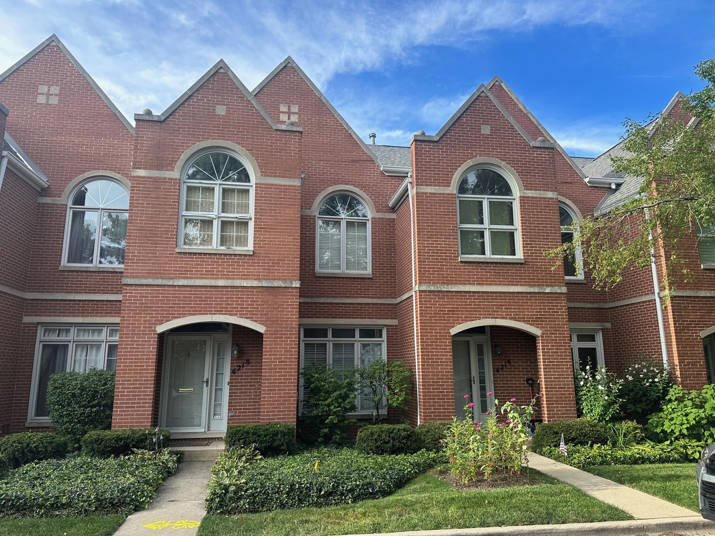 a front view of a house with yard