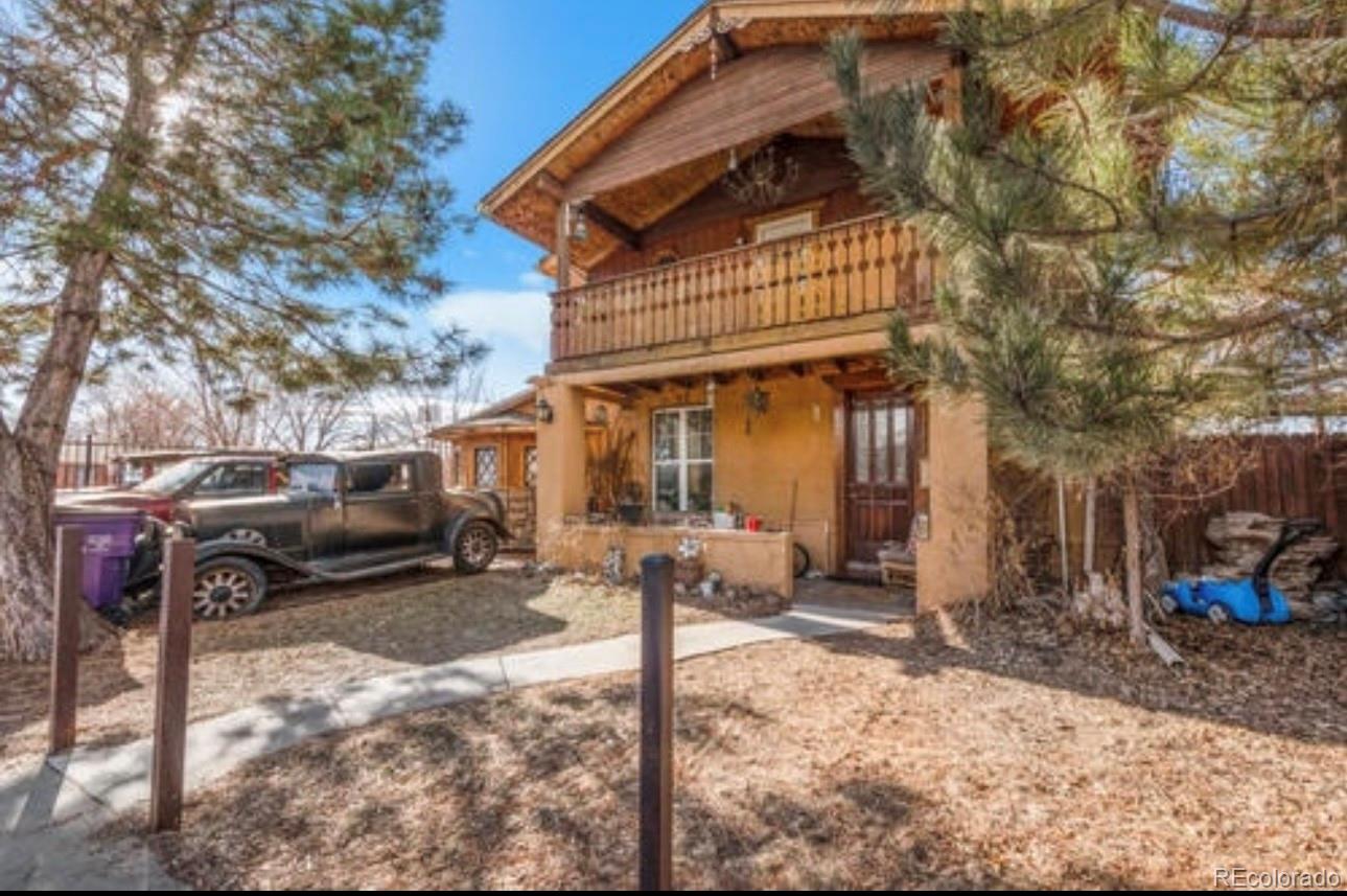 a front view of a house with parking yard