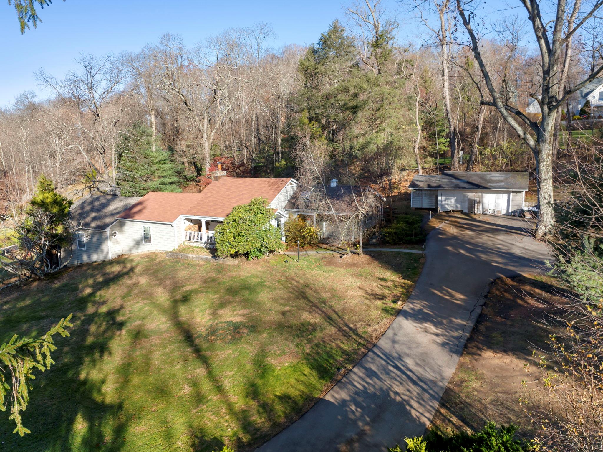 Birds eye view house with garage to right