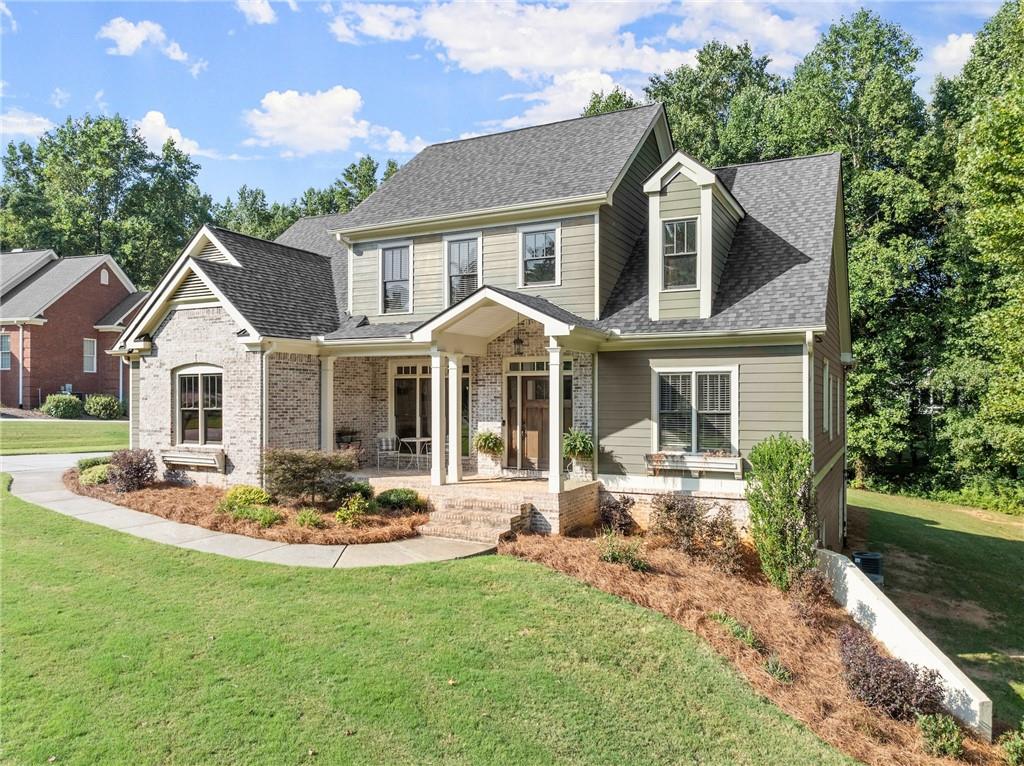 a front view of a house with a yard