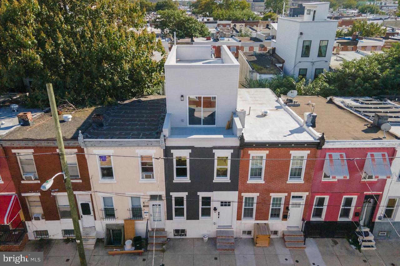 an aerial view of residential houses with outdoor space