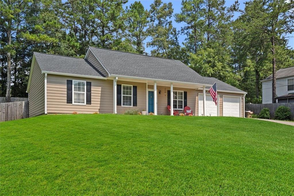 a house that is sitting in the grass