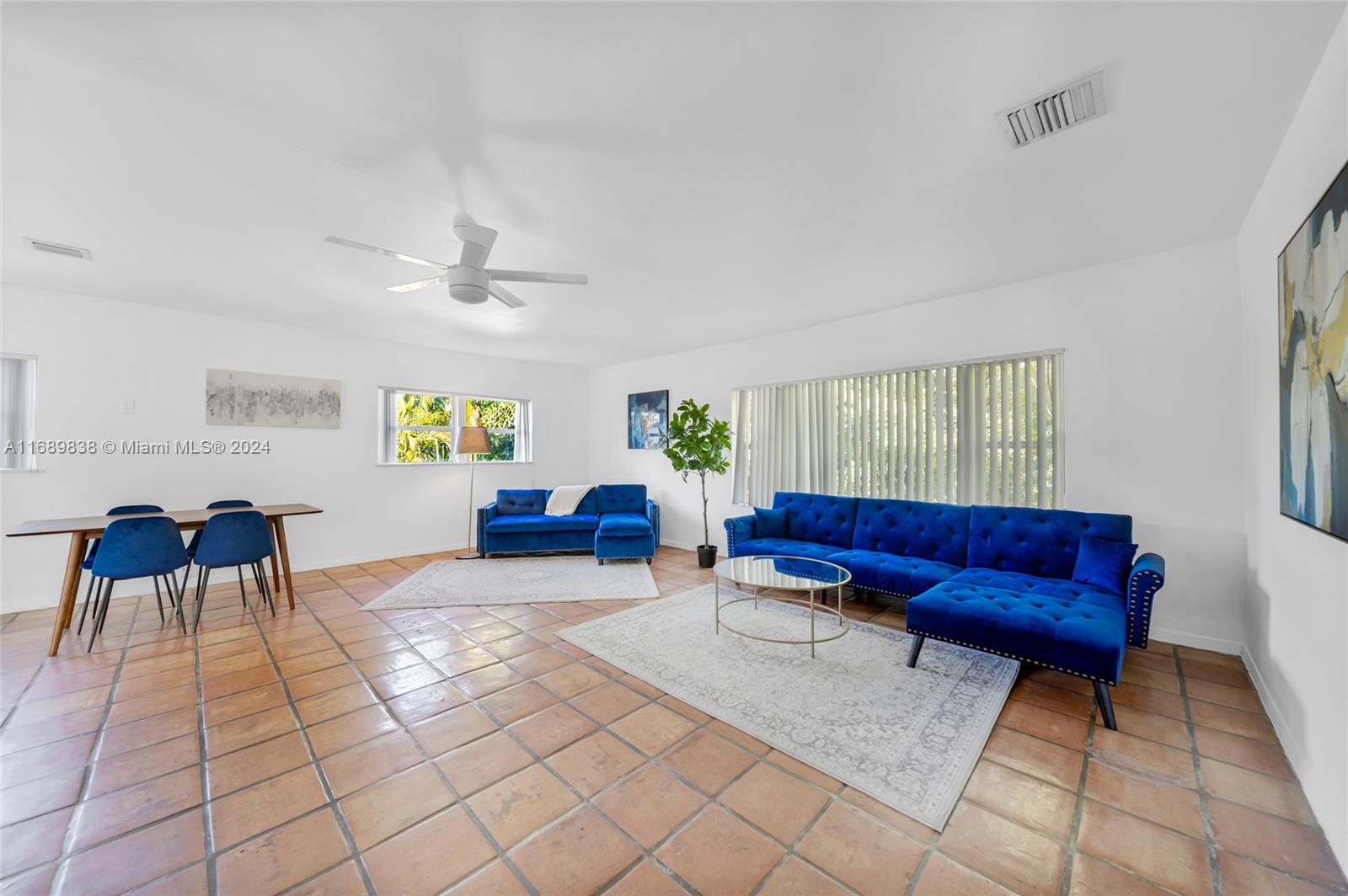 a living room with furniture and a rug