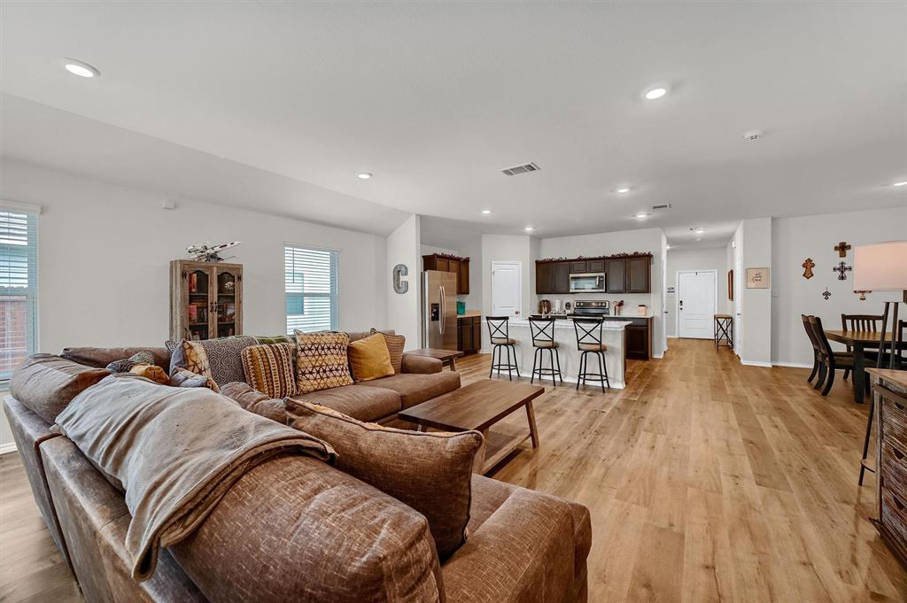 a living room with furniture and a table