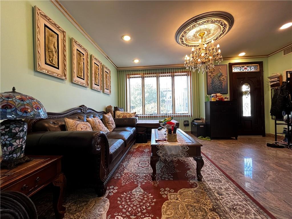 a bed room with furniture and a chandelier