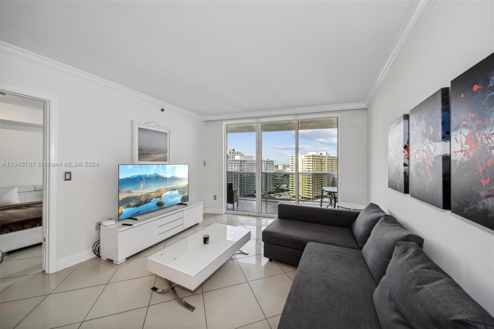 a living room with furniture and a flat screen tv