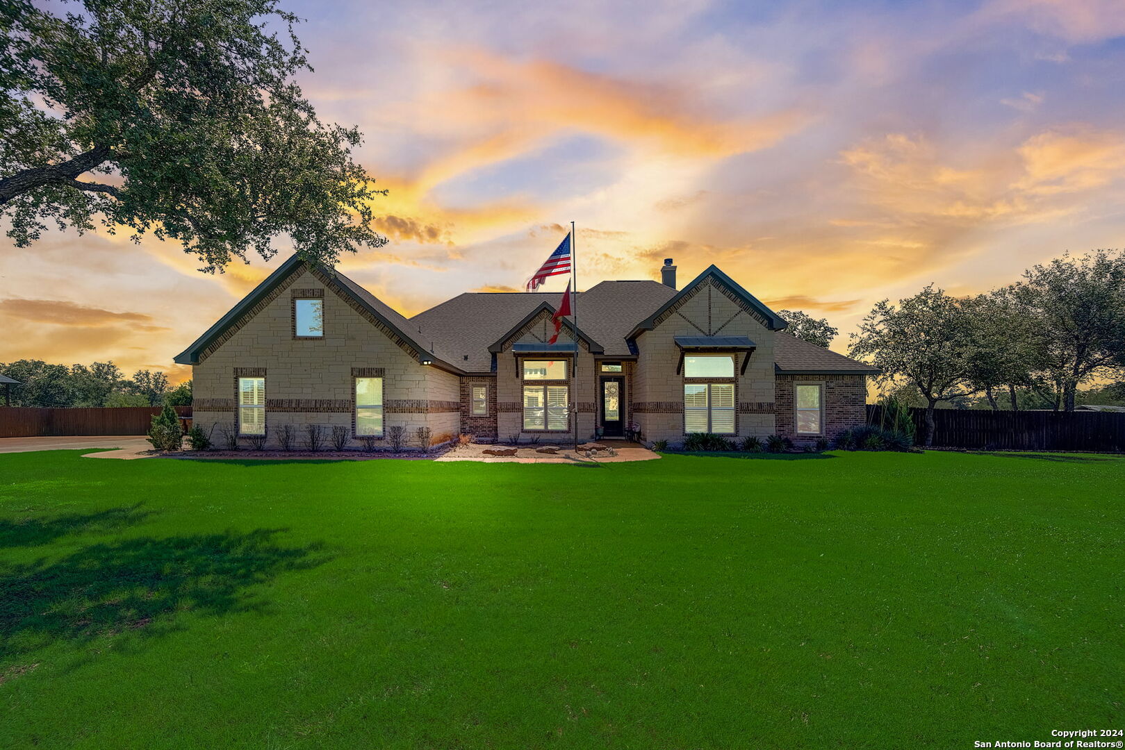 a front view of house with yard and green space