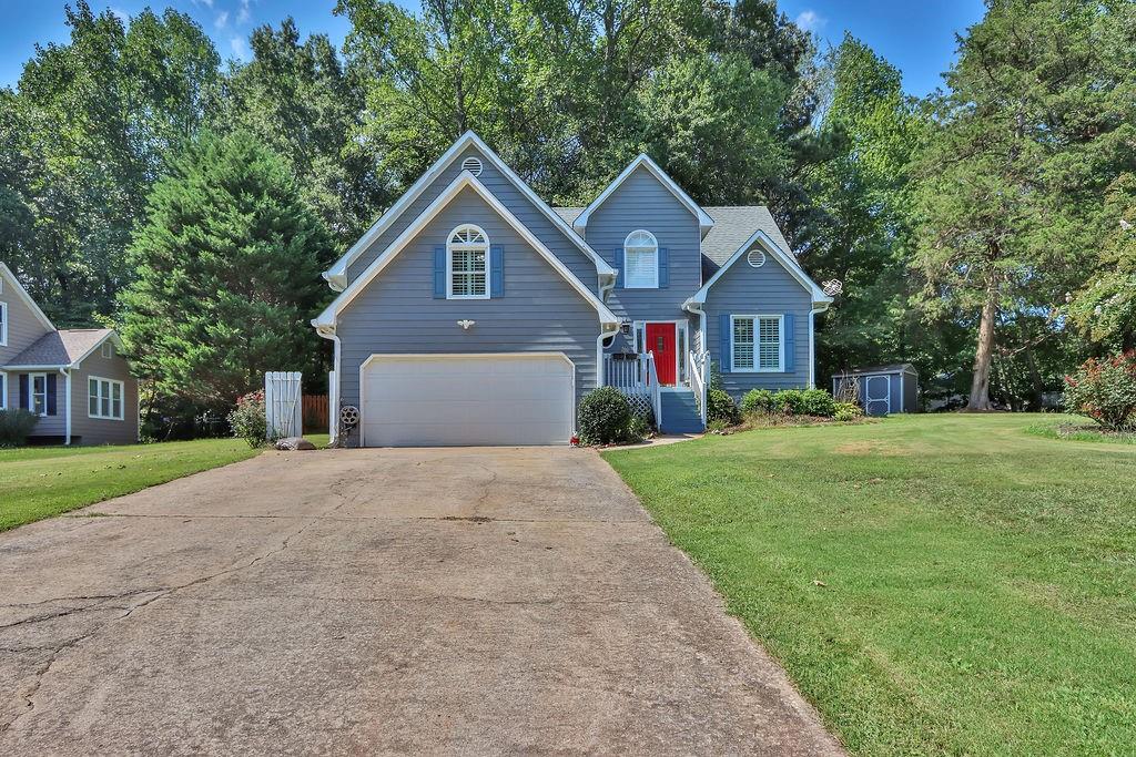 a front view of a house with yard