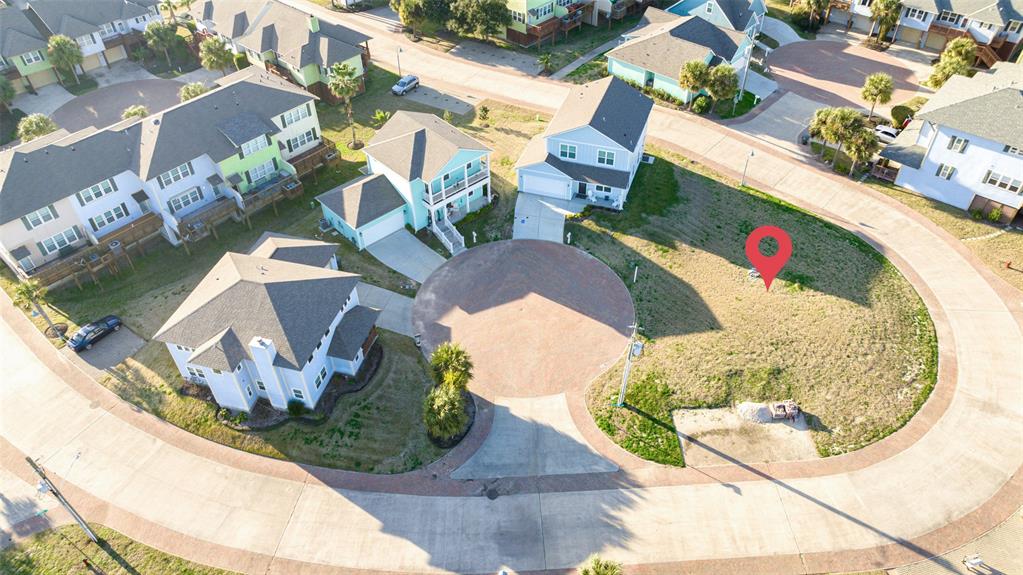 an aerial view of a house with a swimming pool