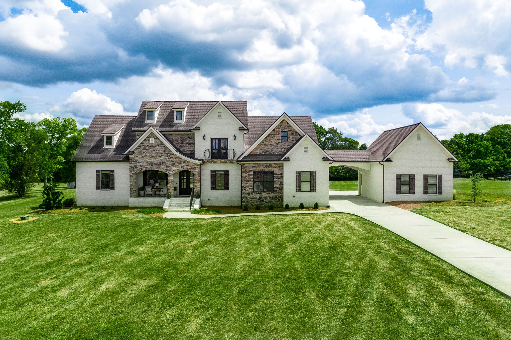 a front view of a house with a yard