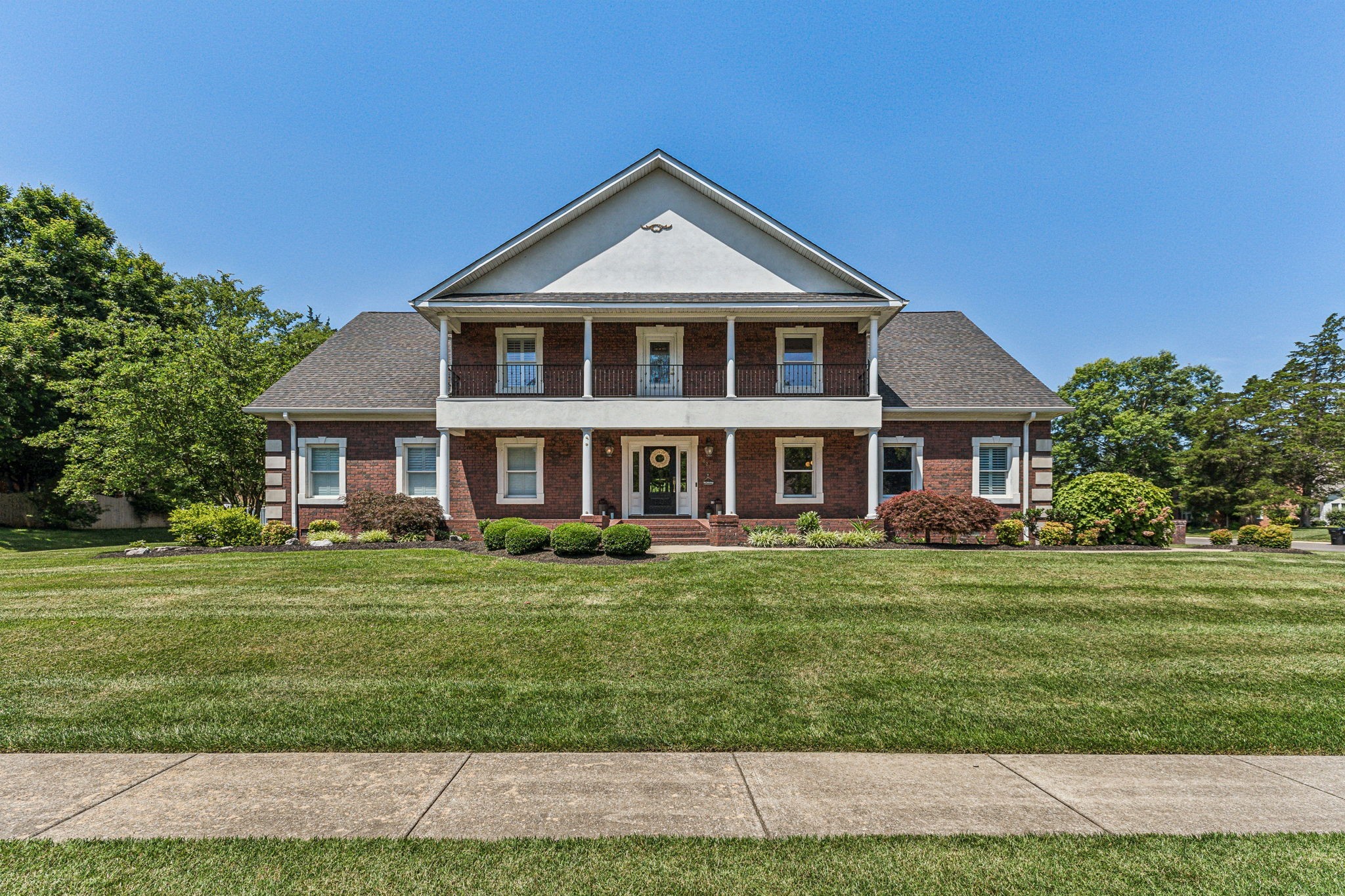 a front of a house with a yard