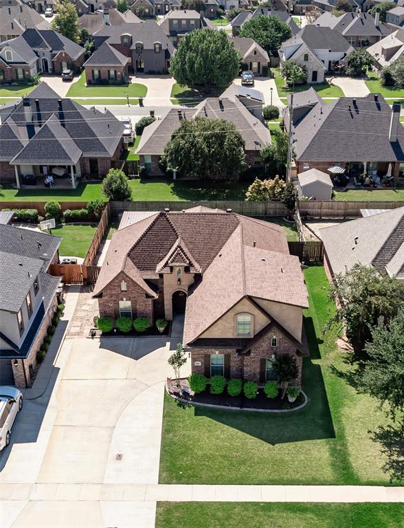 an aerial view of a house with a garden