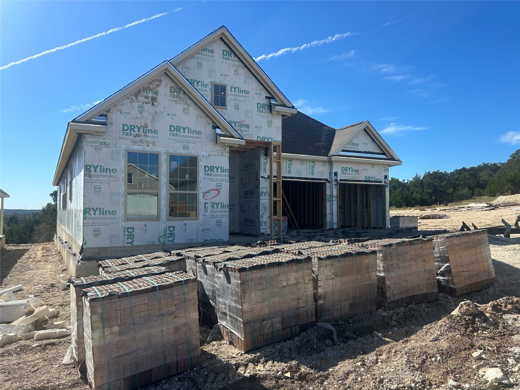 a view of multiple houses with a yard