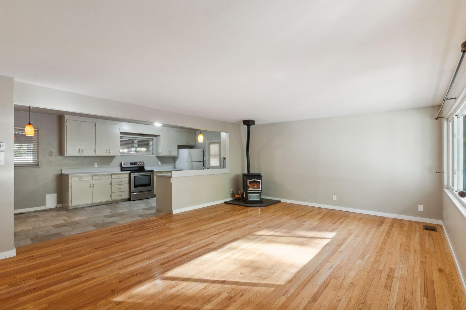 a view of a kitchen with wooden floor