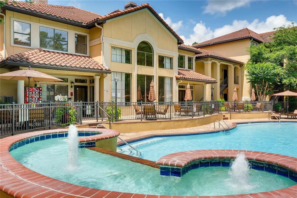 a swimming pool with outdoor seating and yard