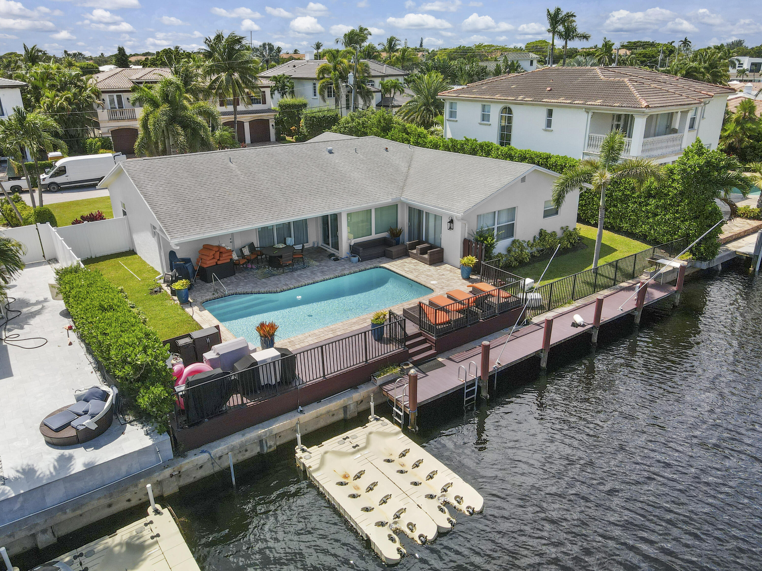 an aerial view of a house with garden space and street view