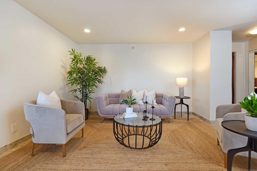 a living room with furniture and a potted plant