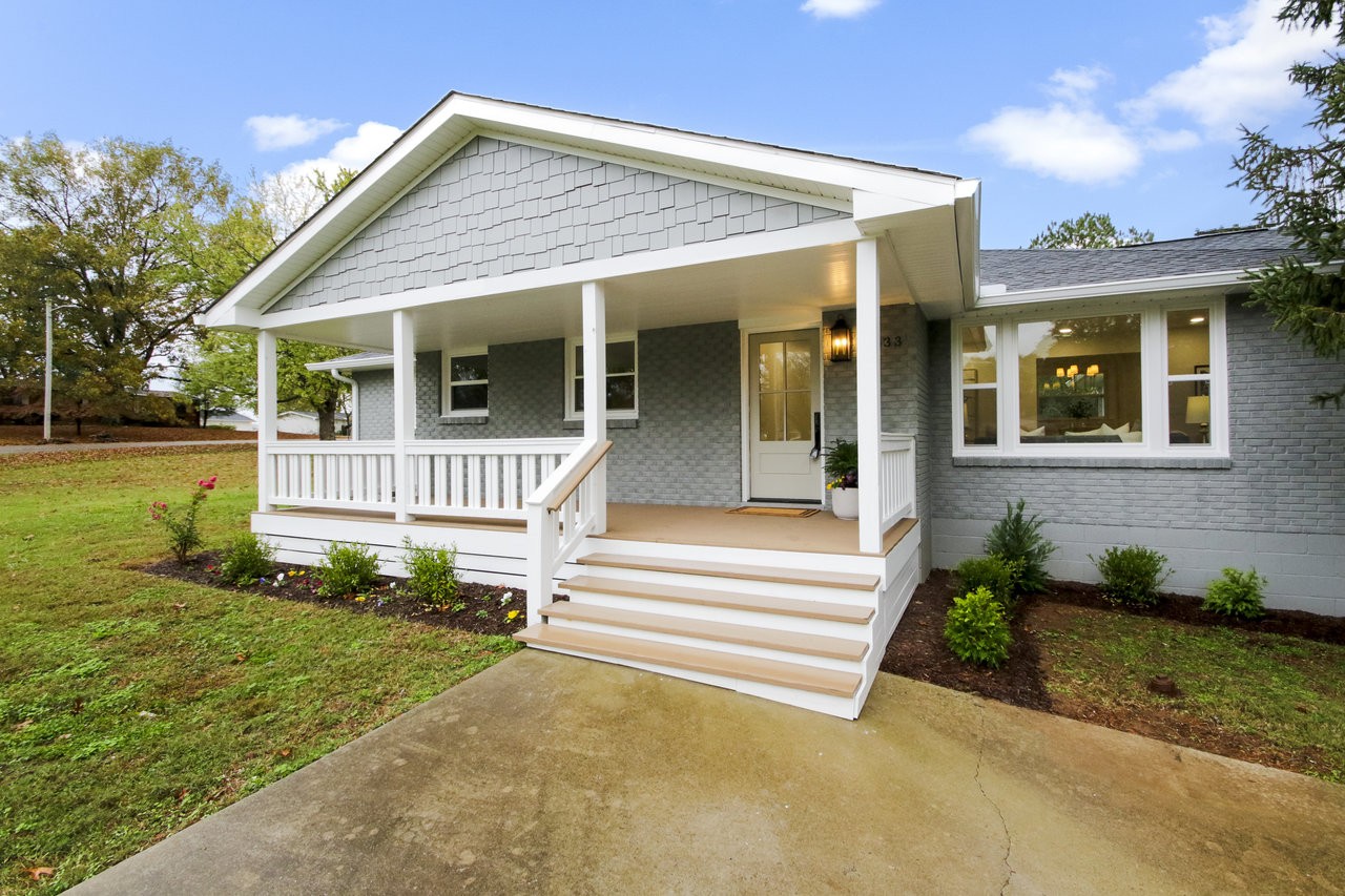 Retreat to your new home, where a charming covered front porch offers the perfect spot to relax and take in the peaceful surroundings