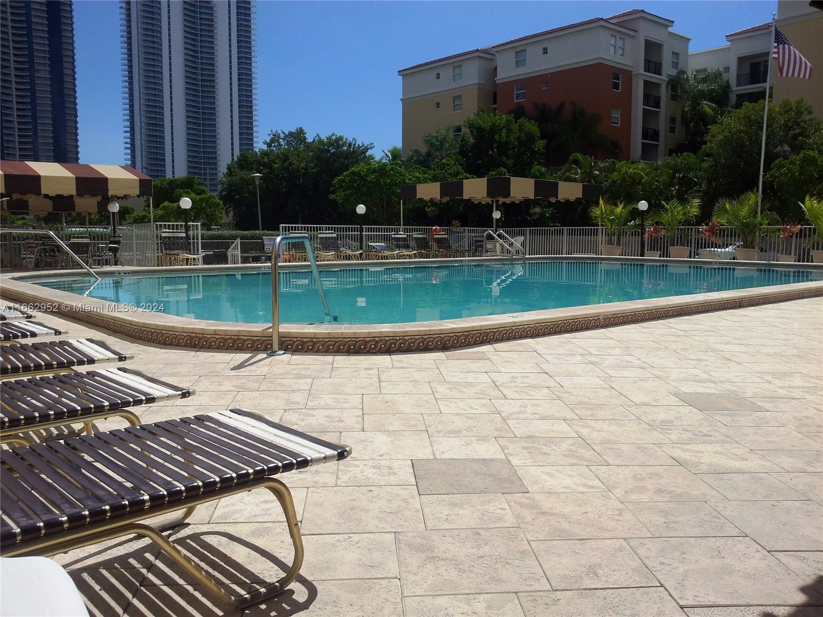 a view of a swimming pool with a patio