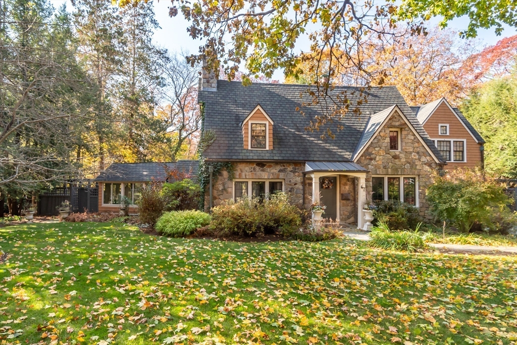 a front view of a house with garden