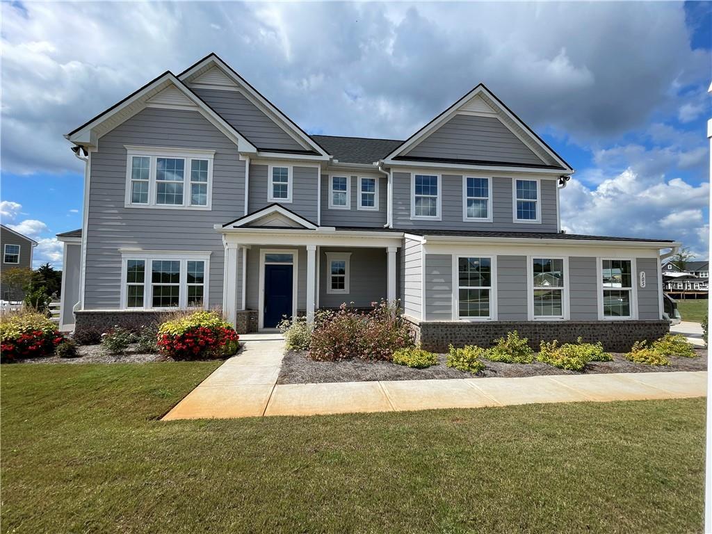 a front view of a house with a yard