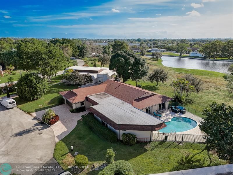 an aerial view of a house with outdoor space