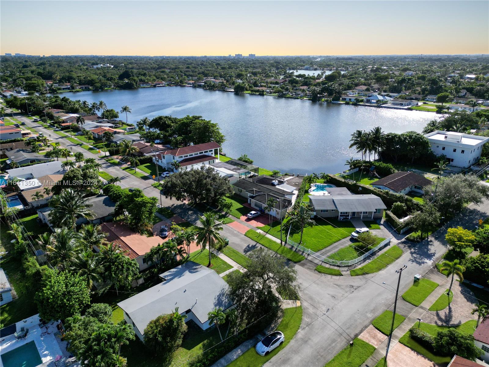 an aerial view of lake residential houses with outdoor space and lake view