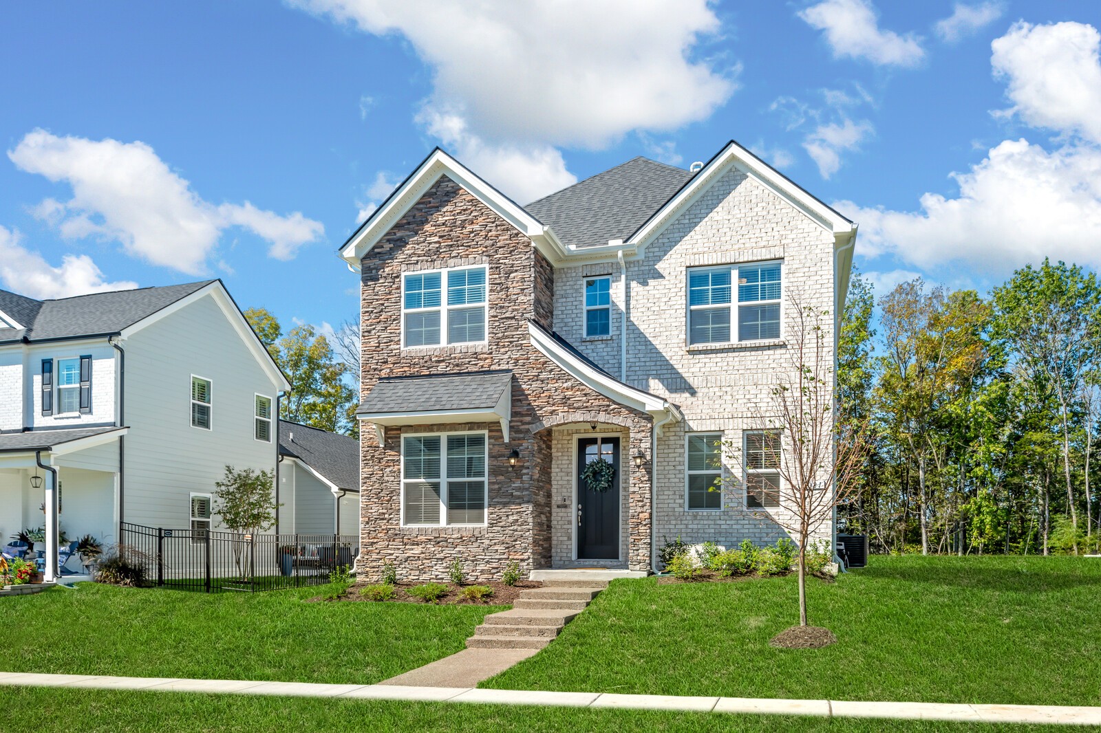 a front view of a house with a yard