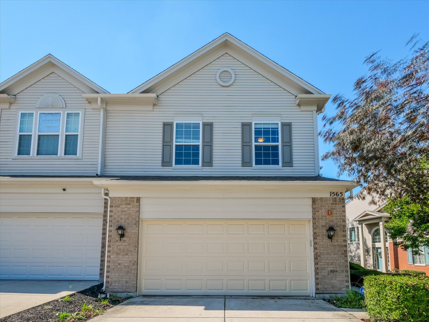 a front view of a house with a garage