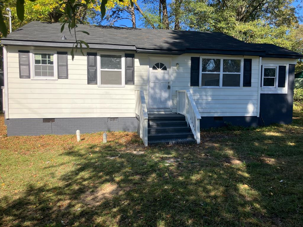 a front view of a house with a yard