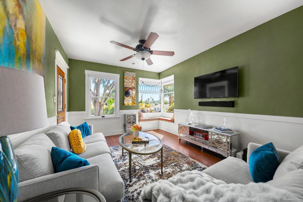 a living room with furniture and a flat screen tv