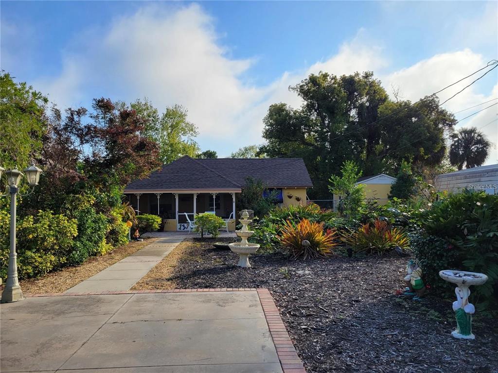 a view of a garden with a patio