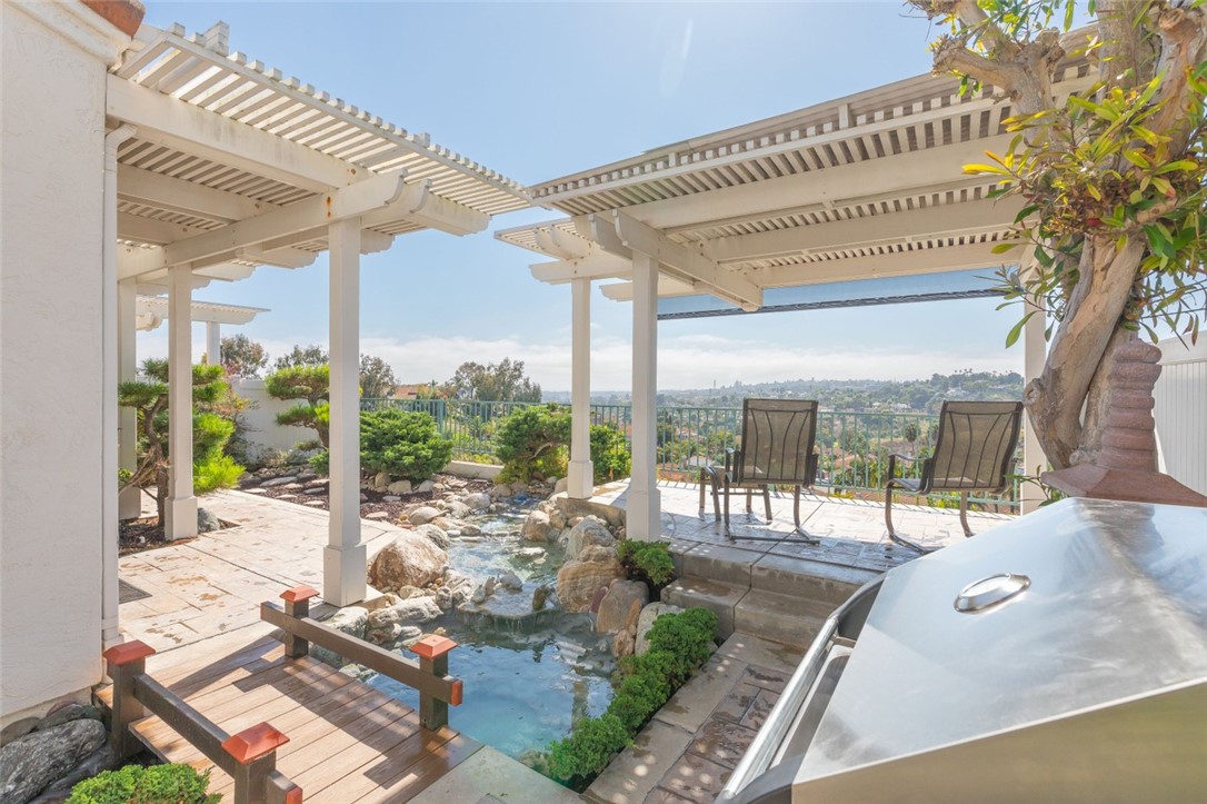 a view of a patio with a table chairs and balcony