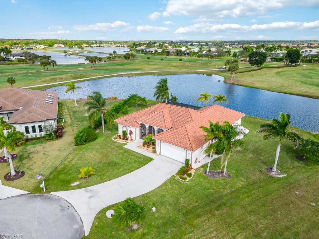 an aerial view of a house with a lake view