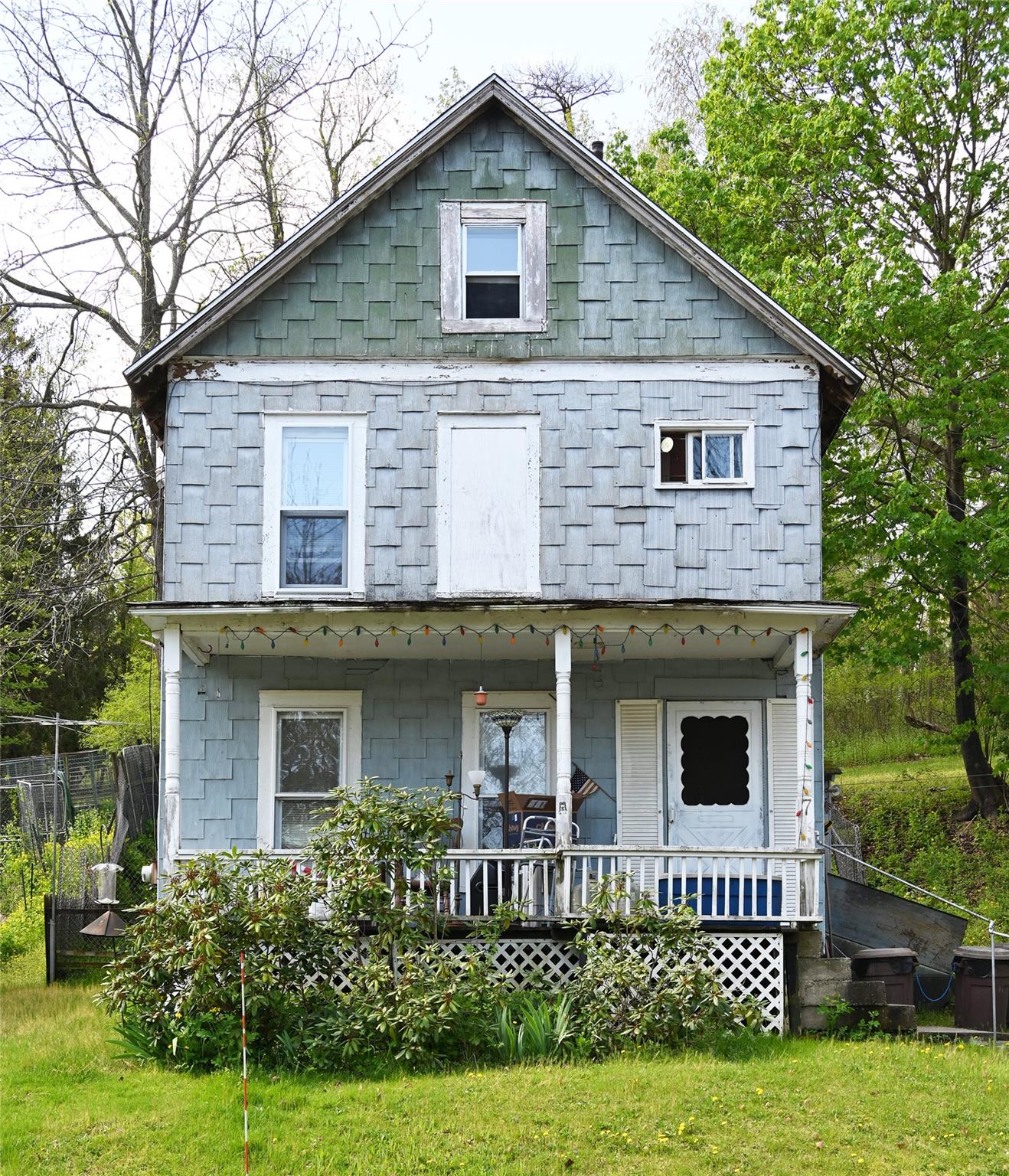 Rear view of property with a porch