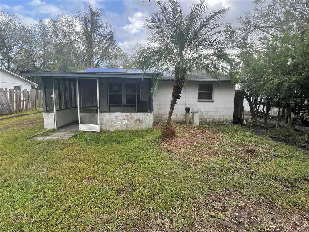 a house with trees in the background