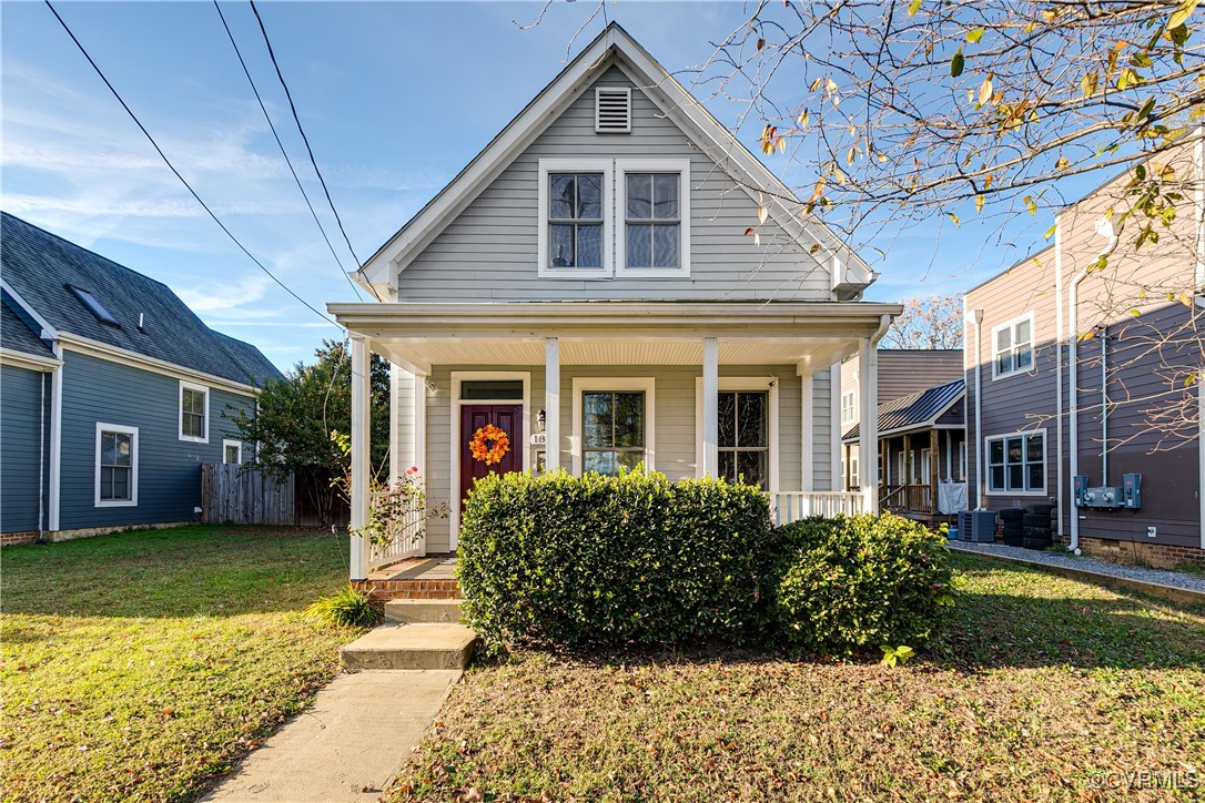 Bungalow with a front yard and central AC