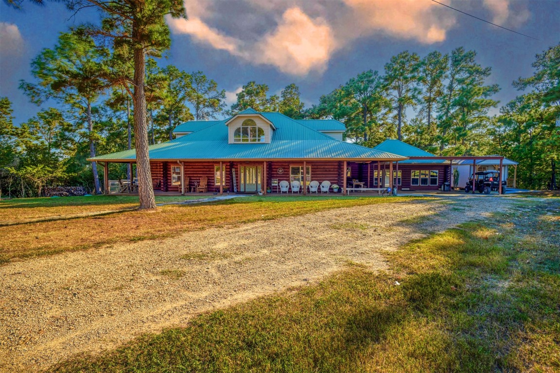 Custom log home situated on 17.33 with lots of pine trees!