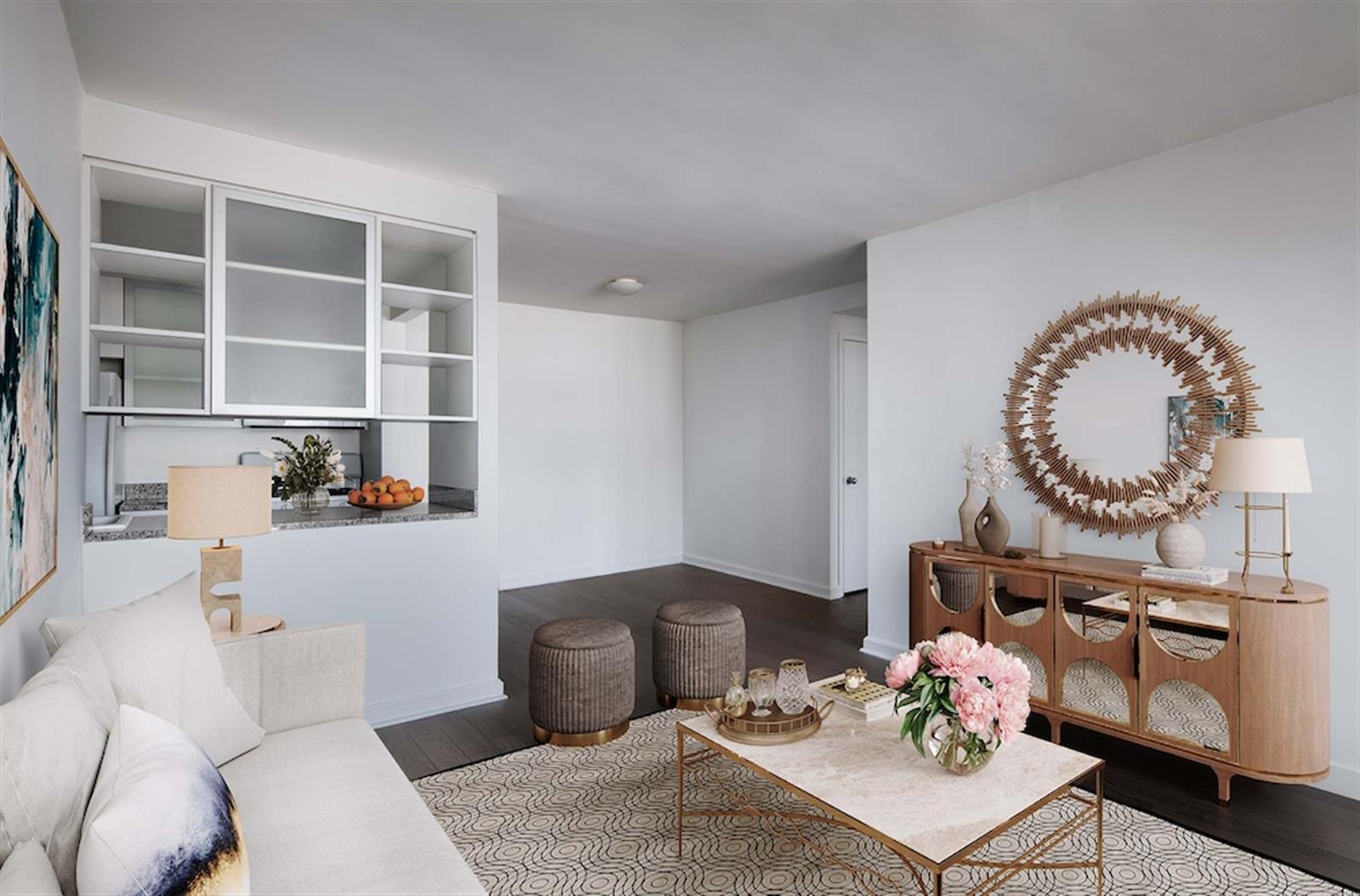 a living room with furniture a rug and a fireplace